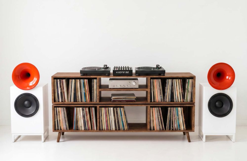 DJ mixing desk with vinyl record storage